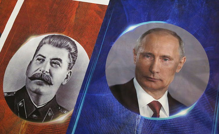 A photo of Joseph Stalin stands next to a photo of Vladimir Putin.