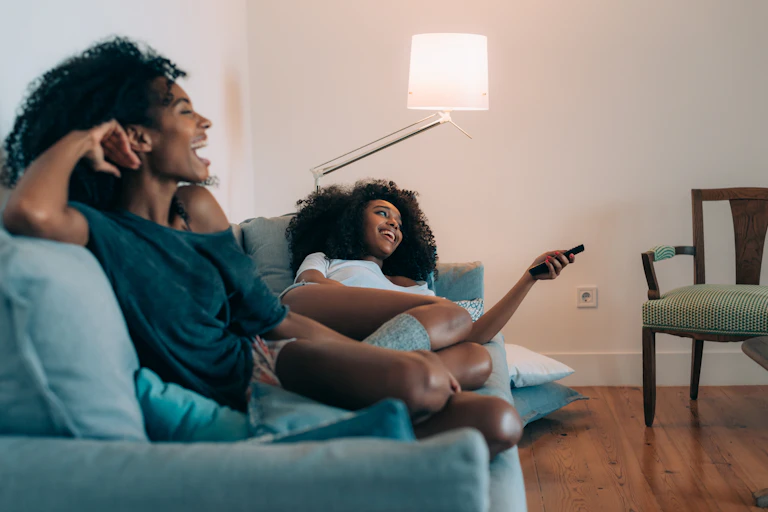 Two Black woman on a couch