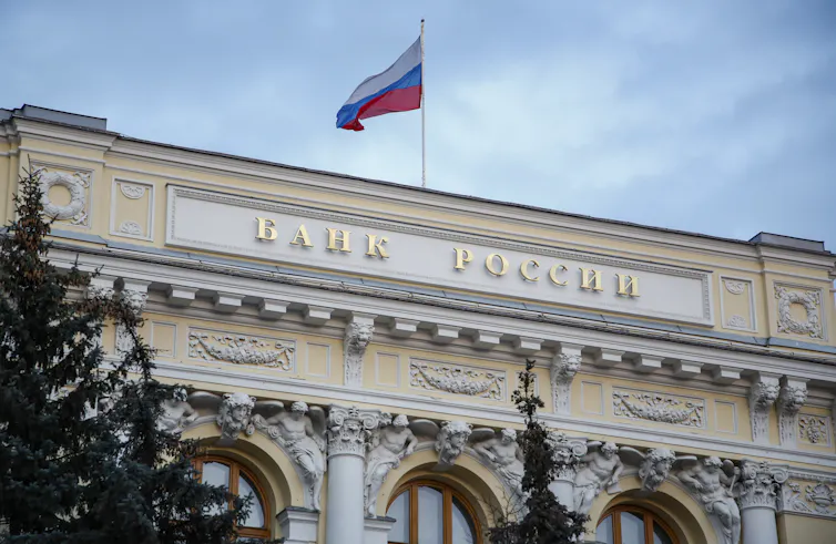 The front of the Central Bank of the Russian Federation headquarters, with a flag flying on the roof