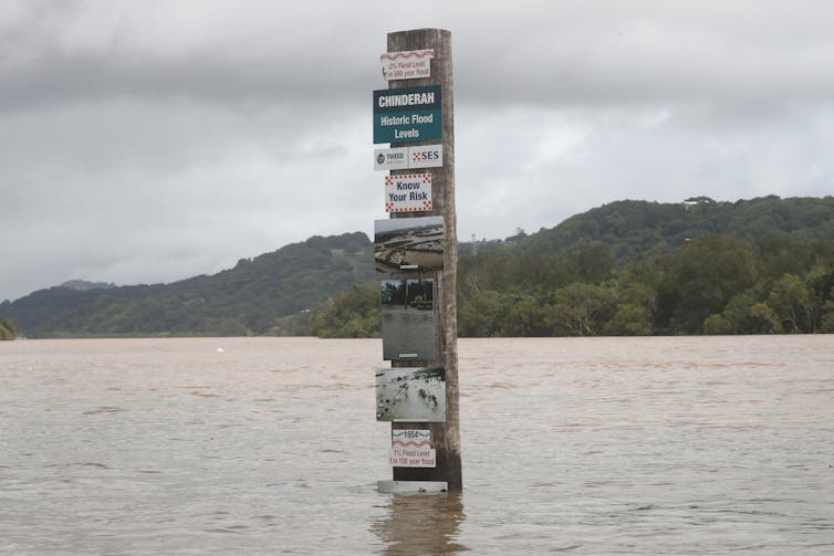 A sign of floods present and past in Chinderah, northern NSW, on March 1 2022