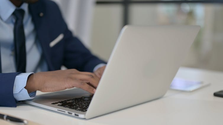 A doctor using a laptop