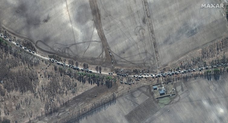 Satellite image of a convoy of Russian tanks on the road to Kyiv, Ukraine.