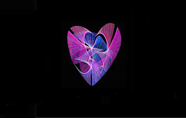 Light painting of heart with purple, blue, and red lines against black background