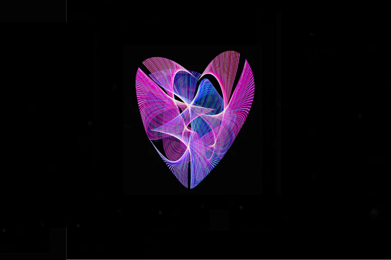 Light painting of heart with purple, blue, and red lines against black background