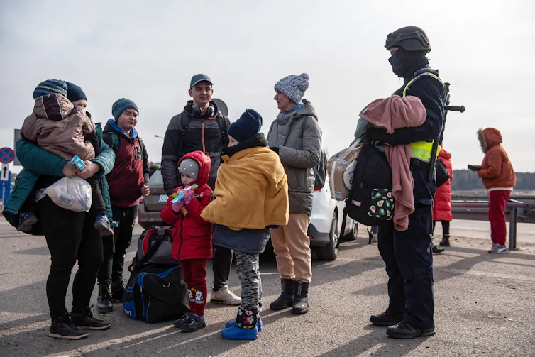 A group of refigees at the Polish/Ukrainian border.