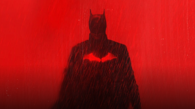 A silhoutte of Batman against a blood red background.