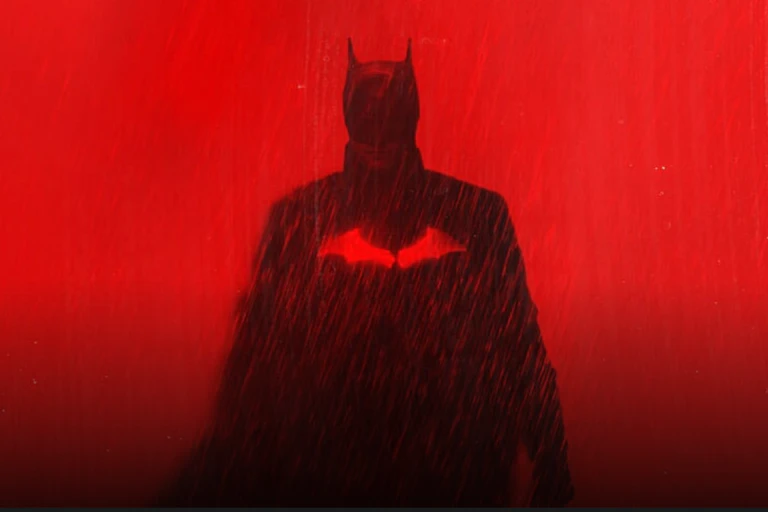 A silhoutte of Batman against a blood red background.
