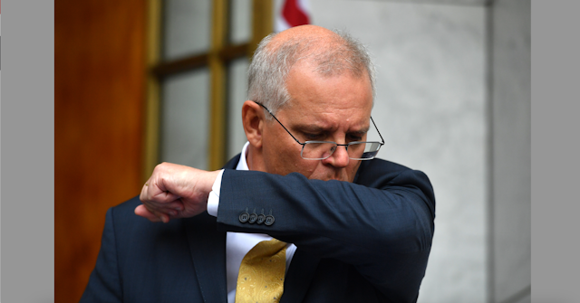PM Scott Morrison coughing into his elbow