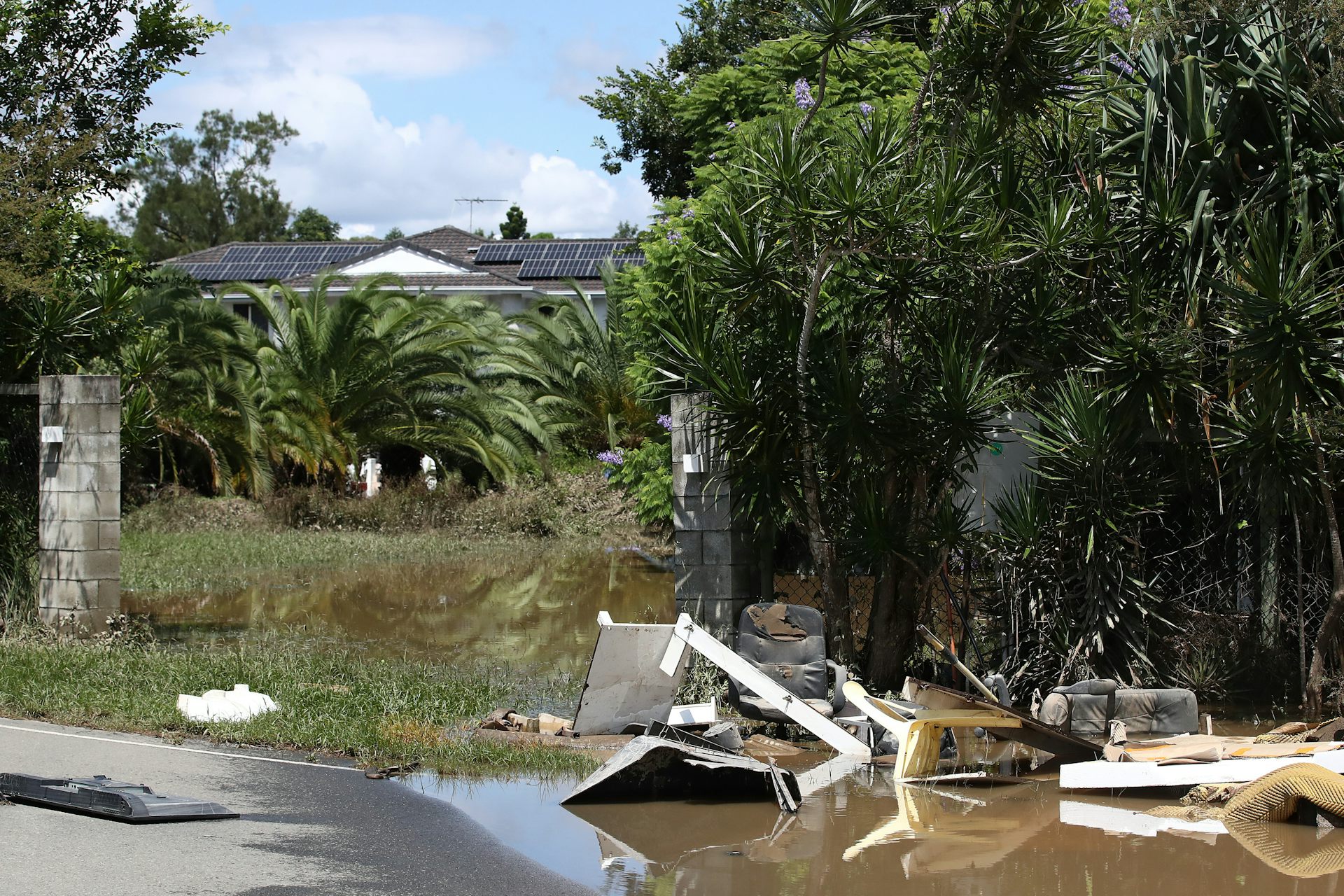 Flood-affected house and yard in Queensland.
