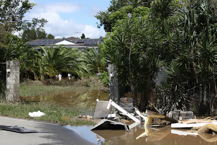 Flood-affected house and yard in Queensland.