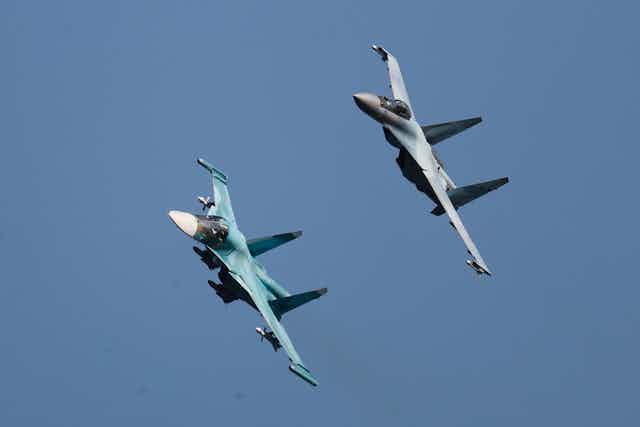 Sukhoi Su-34 fighter-bomber/strike aircraft (L) and a Russian Sukhoi Su-35 multi-role fighter