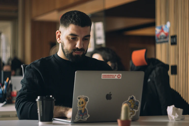 A man on a laptop.
