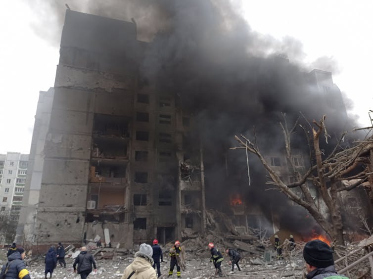 Firefighters work to extinguish a fire at a damaged city centre after a Russian air raid in Chernigiv.