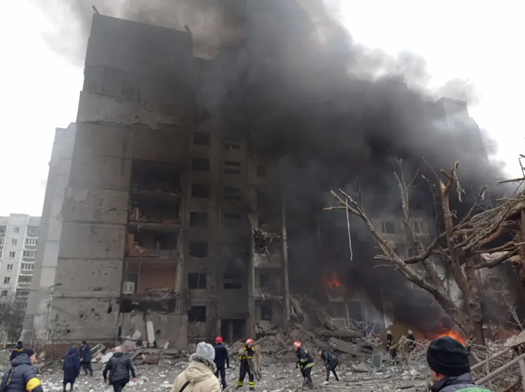 Firefighters work to extinguish a fire at a damaged city centre after a Russian air raid in Chernigiv.