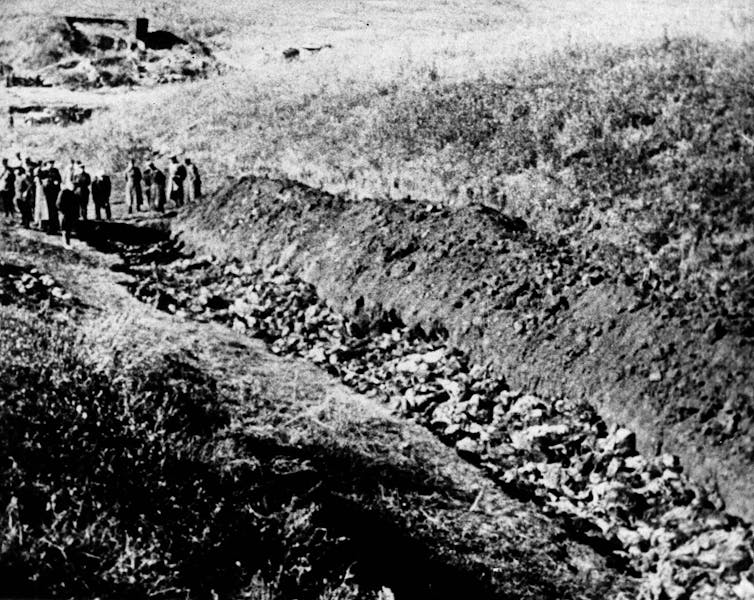 A black and white photo showing the site of a massacre of Jews in the Babi Yar ravine in Ukraine.