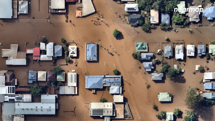 aerial view of flooded streets and roofs