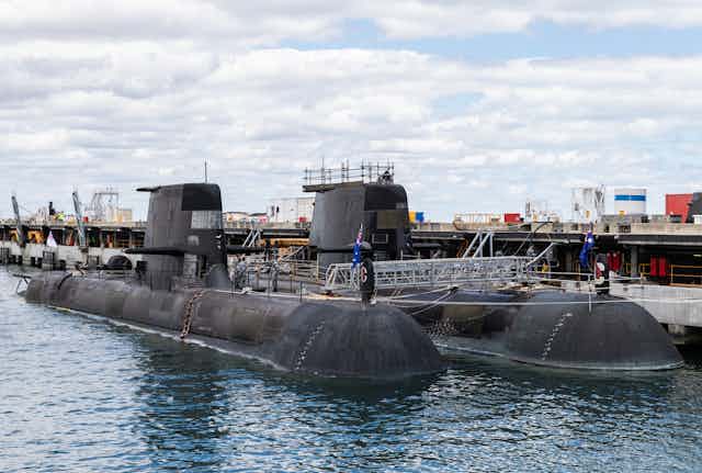 Australian Collins class submarine (front) and the UK nuclear-powered attack submarine, HMS Astute (rear) are seen at HMAS Stirling Royal Australian Navy base in Perth