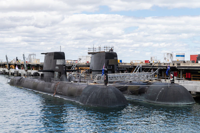 Australian Collins class submarine (front) and the UK nuclear-powered attack submarine, HMS Astute (rear) are seen at HMAS Stirling Royal Australian Navy base in Perth