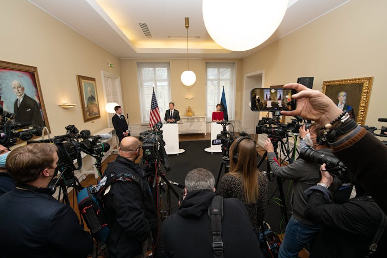 Press photographers and journalists at a press conference with US secretary of state, Antony Blinken, and Estonian prime minister, Kaja Kallas.