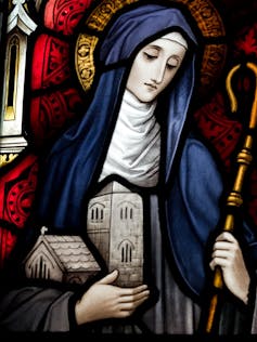 A stained-glass image of Saint Brigid.