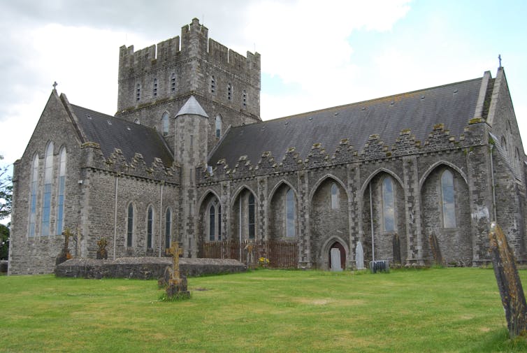 An ancient cathedral with gray stone walls.