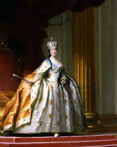 A painting of a woman in ornate robes and a crown carrying a sceptre.