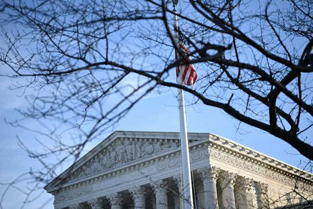 A U.S. flag flies above the Supreme Court.