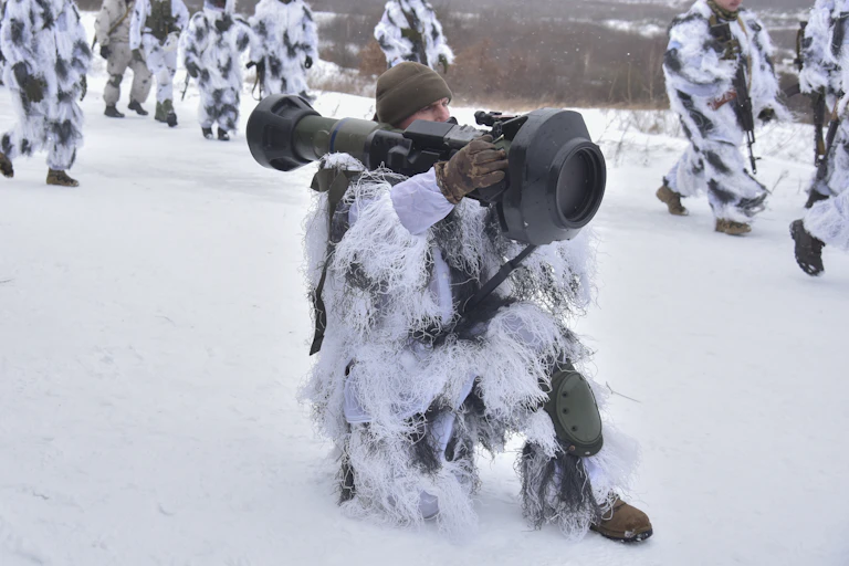 Soldier fires anti-tank missile.