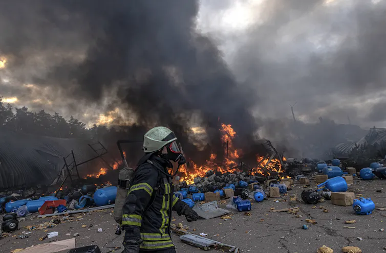 Ukrainian firefighters in action after a Russian missile was shot down to a village near Kyiv.