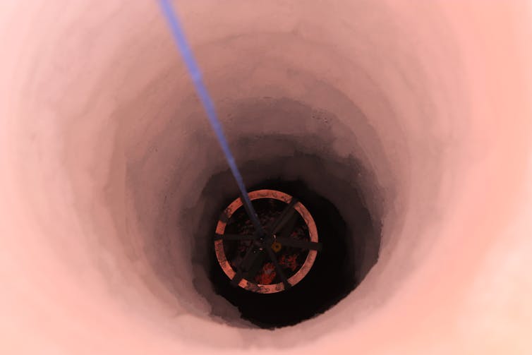 Instruments are lowered through a 400m borehole in the Ross Ice Shelf to sample life in the ocean below.
