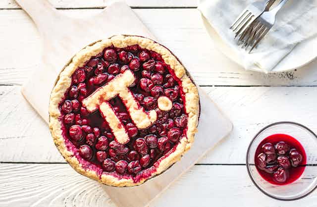 A cherry pie with the pi symbol on it.