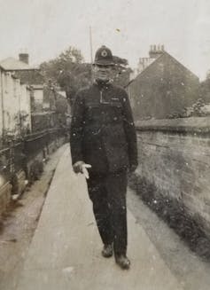 man in 1940s police uniform