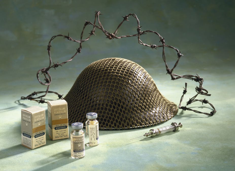 glass vials, syringe, helmet, barbed wire