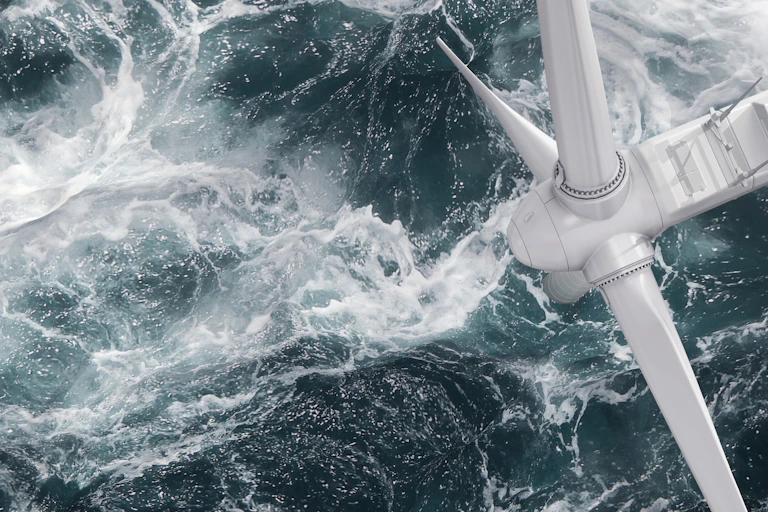 Wind turbine at sea seen frmo above