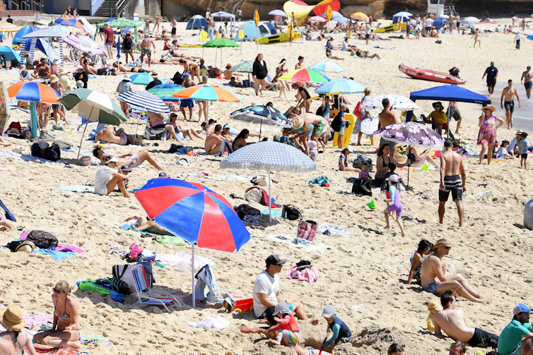 crowded beach on hot day