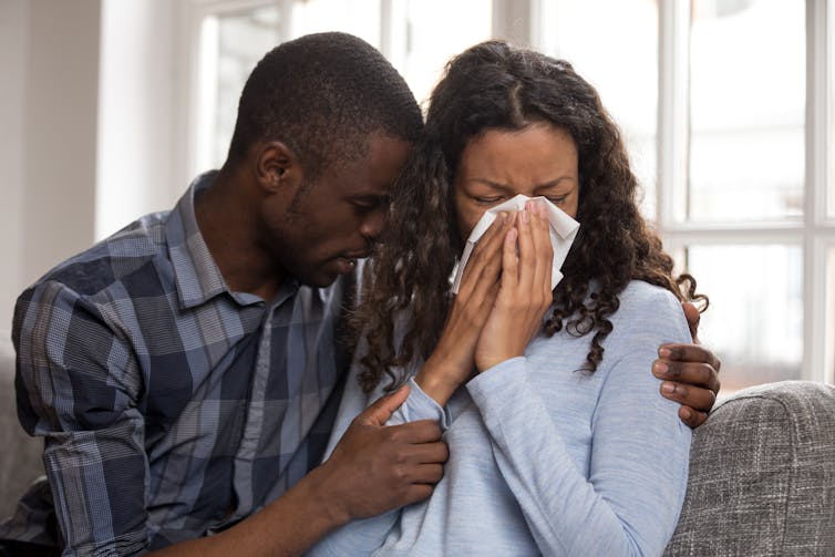 Two people grieving