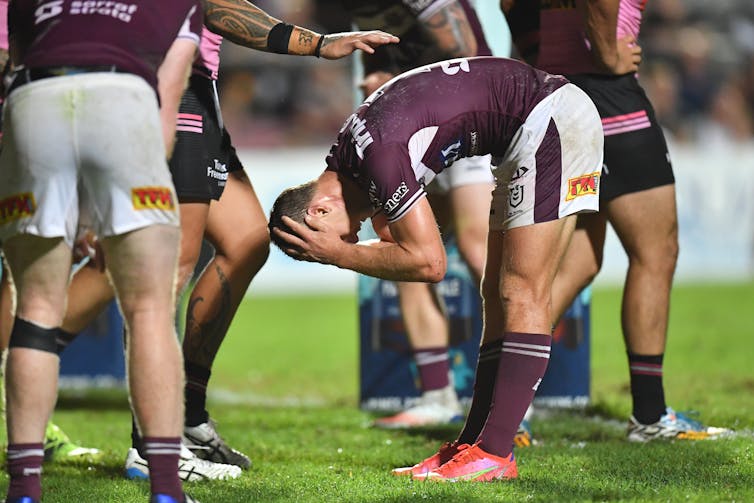 Rugby league players looking upset