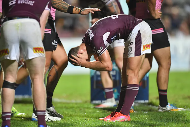 Rugby league players looking upset