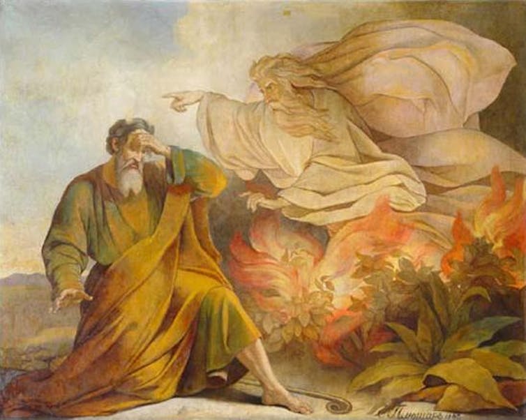 God speaks with Moses at the burning bush in a painting.