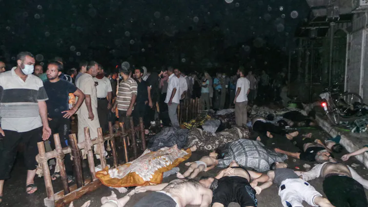 The bodies of people killed in a saran attack in Ghouta, near Damascus in Syria.