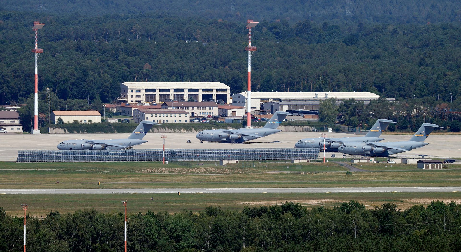 Military aircraft on aiport runway.