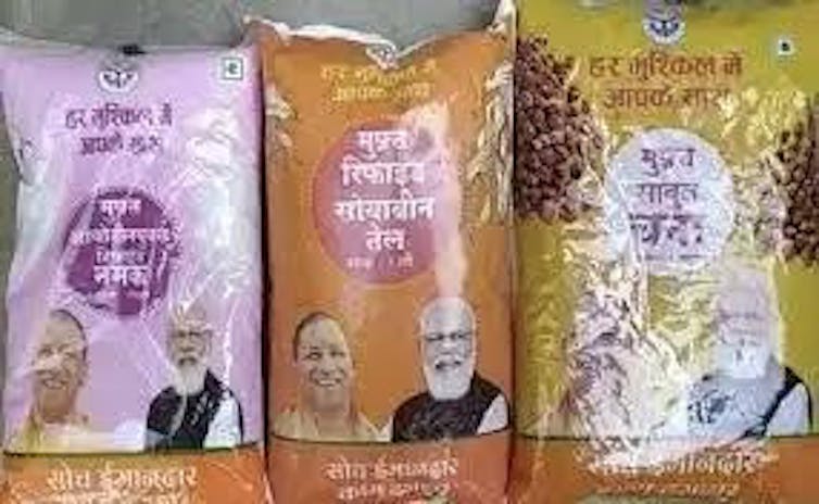 Three packets of rice with Prime Minister Modi's photo on them