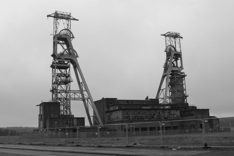Black and white picture of a derelict coal mine.