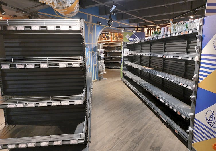 Empty shelves in a supermarket in Chernihiv, northern Ukraine.