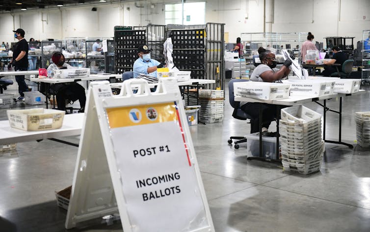 Workers count election ballots