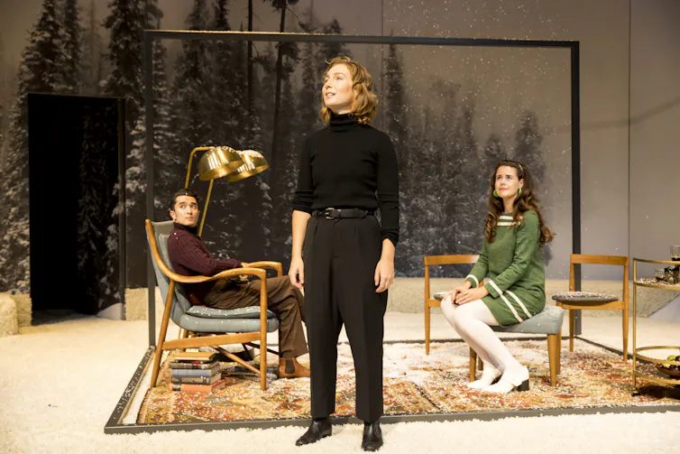 Three young actors on stage.