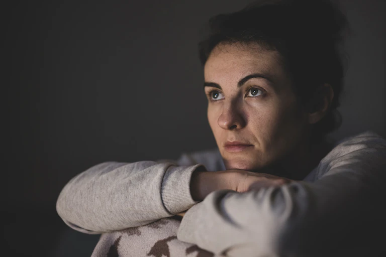 woman looks tired and worried