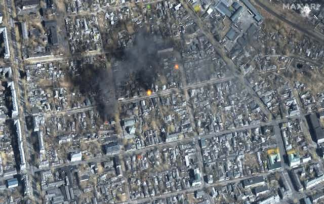 Aerial shot fires burning in Eastern Mariupol, Ukraine, 