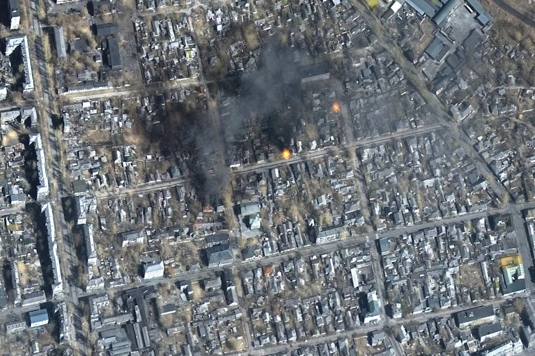 Aerial shot fires burning in Eastern Mariupol, Ukraine,