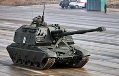 A self-propelled howitzer during rehearsals for a parade.